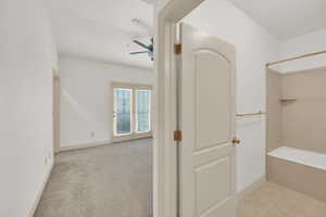 Full bath with baseboards and a ceiling fan