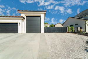 Garage with a gate and driveway