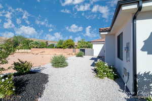 View of yard featuring fence