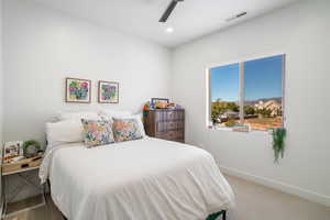 Bedroom with carpet flooring, ceiling fan, and recessed lighting