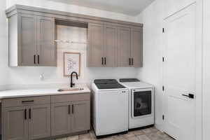 Laundry area with cabinet space and separate washer and dryer