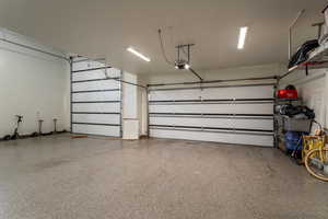 Garage featuring a garage door opener