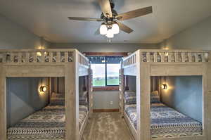 Bedroom featuring baseboards and carpet floors