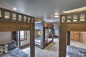 Bedroom with baseboards, recessed lighting, and carpet