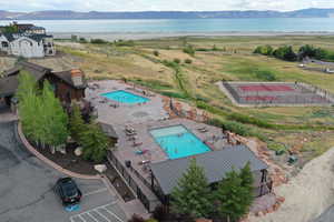 Aerial view featuring a water and mountain view
