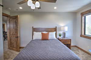 Bedroom with baseboards, visible vents, recessed lighting, and carpet flooring