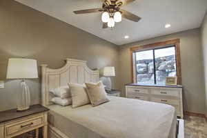 Bedroom featuring baseboards, a ceiling fan, recessed lighting, and carpet