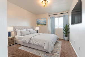 First upstairs bedroom. Carpeted bedroom featuring baseboards