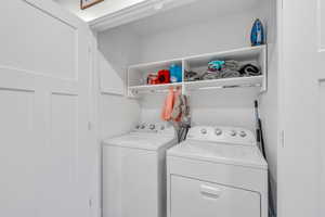 Laundry room with independent washer and dryer and laundry area