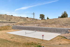 View of yard featuring sports court