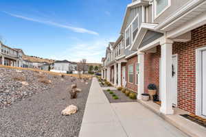 View of home's exterior featuring brick siding and a residential view