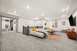 Living Room with recessed lighting and a raised ceiling