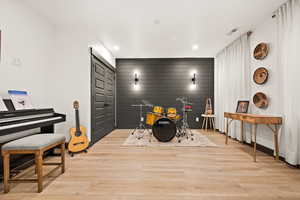 Bedroom featuring light wood-style flooring, and recessed lighting