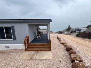 Front porch steps and road view east