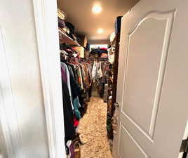 Spacious walk in master closet with natural light.