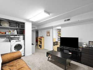 Living room area with laundry closet