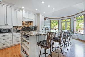 Kitchen with open shelves, stainless steel appliances