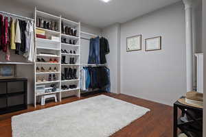 Spacious closet featuring wood finished floors