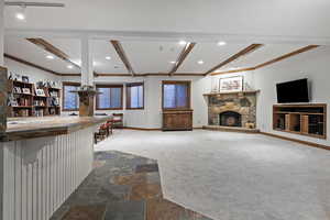 Basement family room featuring kitchenette
