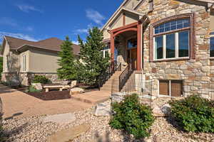 View of front facade featuring stone siding