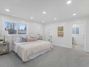 Carpeted bedroom featuring baseboards and recessed lighting