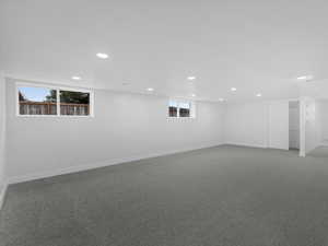 Basement with baseboards, carpet flooring, and recessed lighting