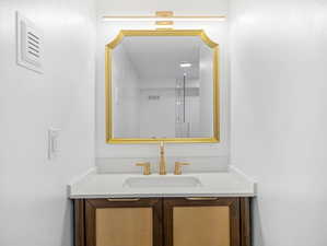 Bathroom with vanity and visible vents