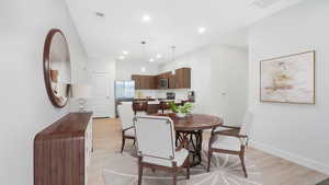 Dining area that opens into an elevated kitchen *Virtually Staged