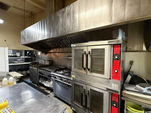 Kitchen featuring freestanding refrigerator