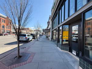View of street featuring sidewalks and street lighting