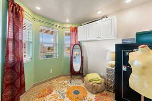 Interior space featuring baseboards, recessed lighting, and a textured ceiling