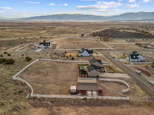 Drone / aerial view with a mountain view, view of desert, and a rural view