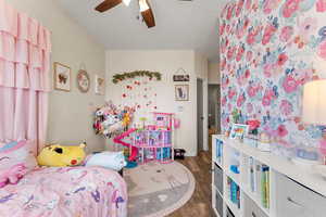Bedroom with a ceiling fan and wood finished floors