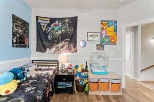 Bedroom featuring wood finished floors