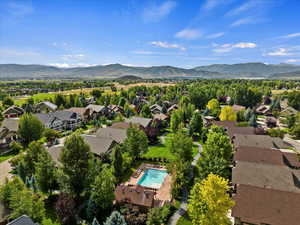 Birds eye view of property with a residential view and a mountain view