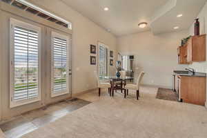 Wet bar and dining area in basement