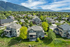 Aerial perspective of suburban area with a mountainous background