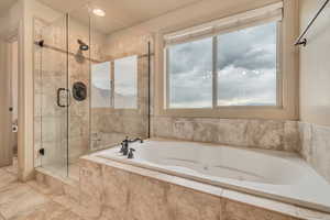Primary ensuite bath, shower, water closet and walk in closet