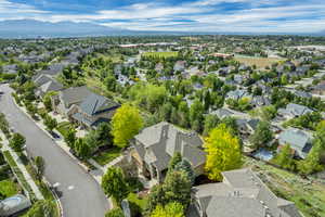 Aerial perspective of suburban area featuring a mountain backdrop