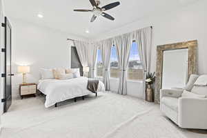 Bedroom with baseboards, ceiling fan, recessed lighting, and light colored carpet