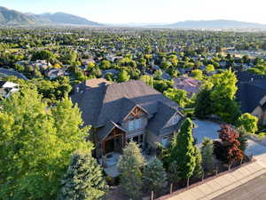 Birds eye view of property with a residential view and a mountain view