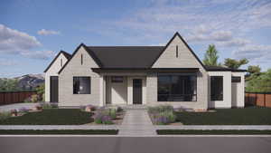 View of front of home with stone siding and fence