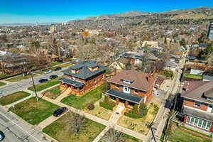 Birds eye view of property with a residential view and a mountain view