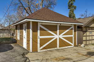 2 car garage - used primarily for storage with sliding wood garage doors.