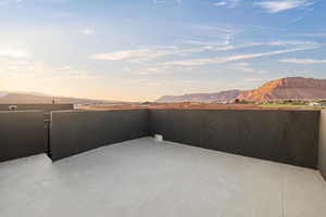 Patio terrace at dusk with a mountain view