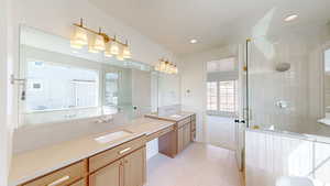 Full bathroom with a shower stall, recessed lighting, and vanity