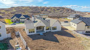Birds eye view of property with a residential view and a mountain view