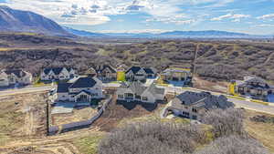 Birds eye view of property featuring a residential view and a mountain view