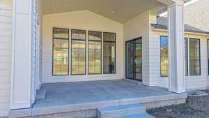 Entrance to property featuring a patio