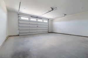 Garage featuring baseboards